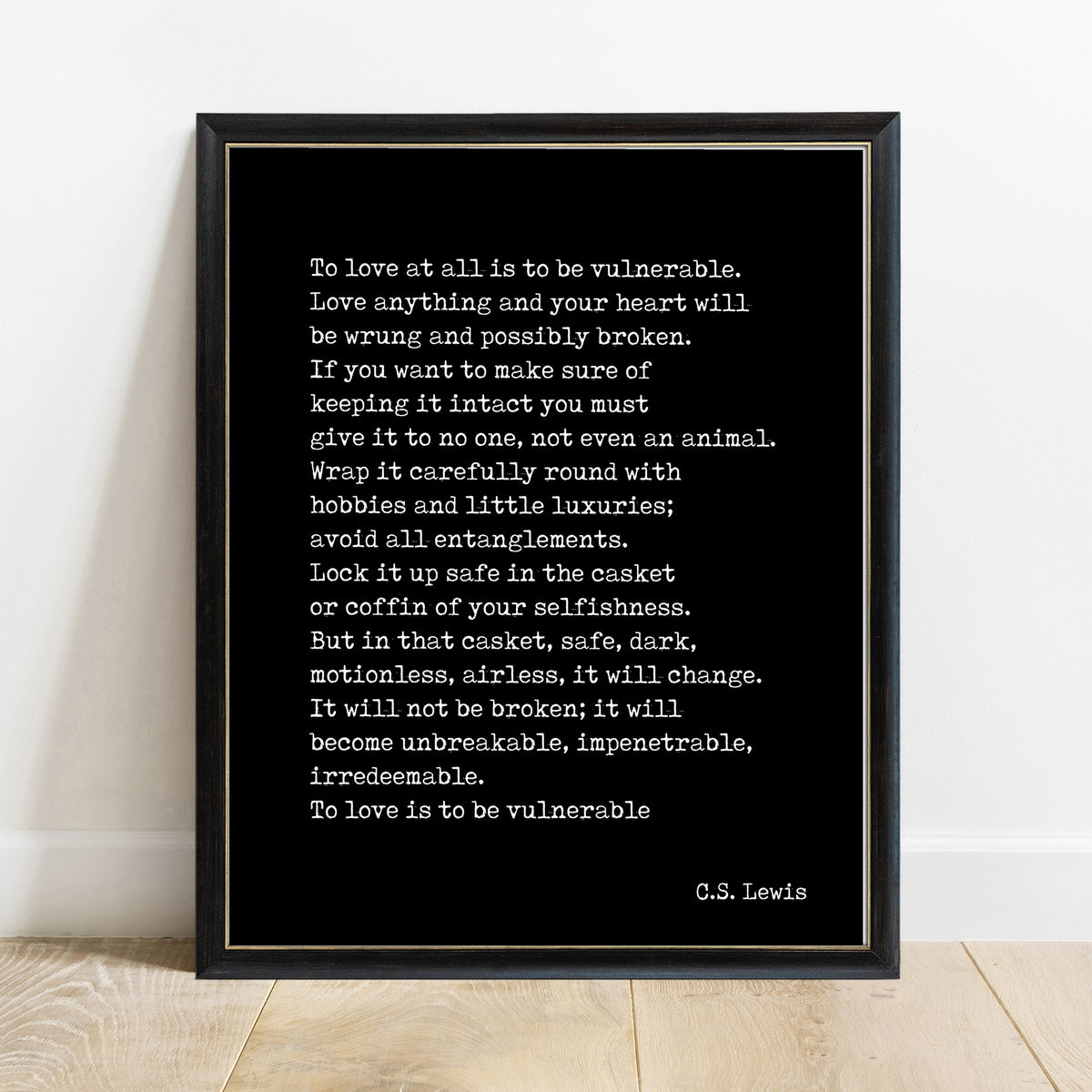 C.S. Lewis to love at all is to be vulnerable passage print in a black frame, black background