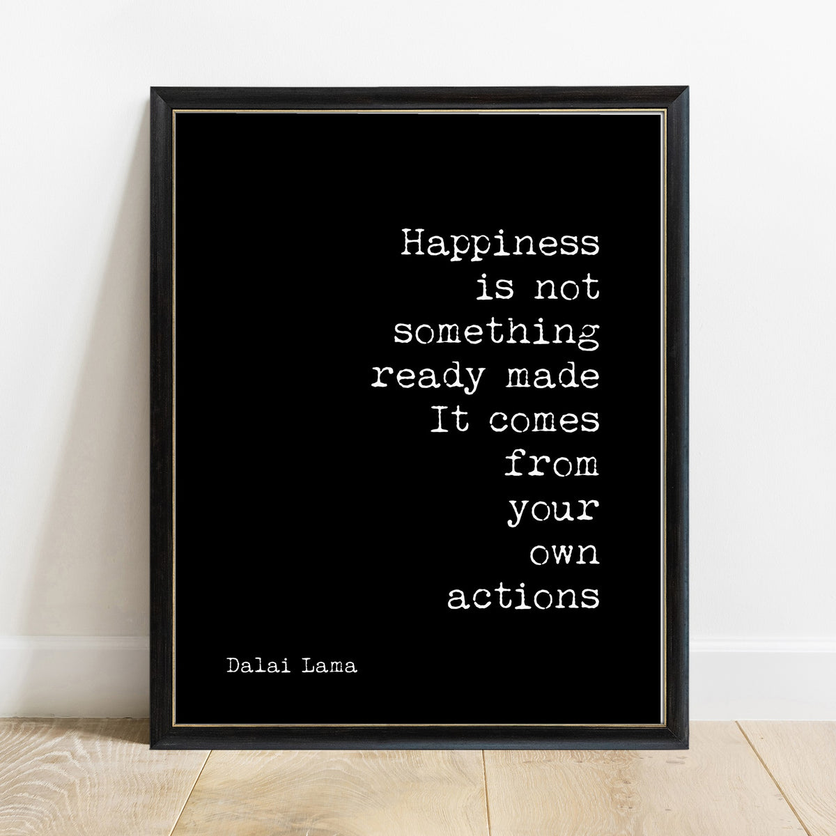Dalai Lama happiness comes from your own actions print in a black frame, black background