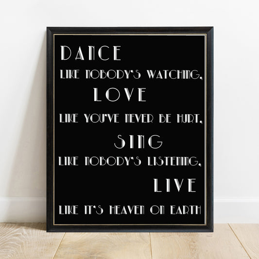 Dance like nobody's watching Alfred D'Souza quote print in a black frame, black background