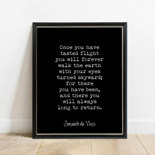 Leonardo da Vinci once you have tasted flight quote print in a black frame, black background