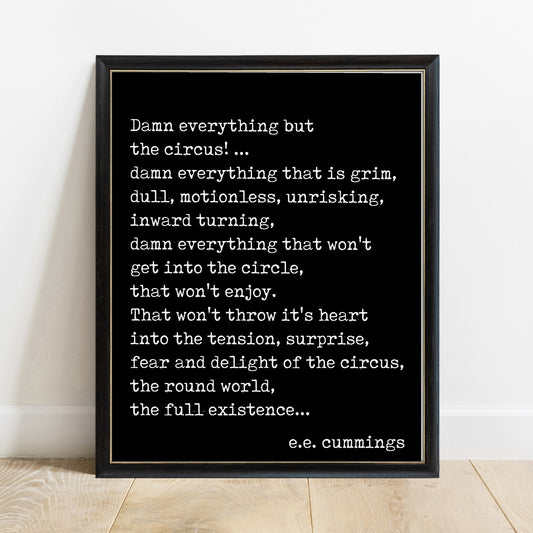 EE Cummings Damn Everything But The Circus print in a black frame, black background