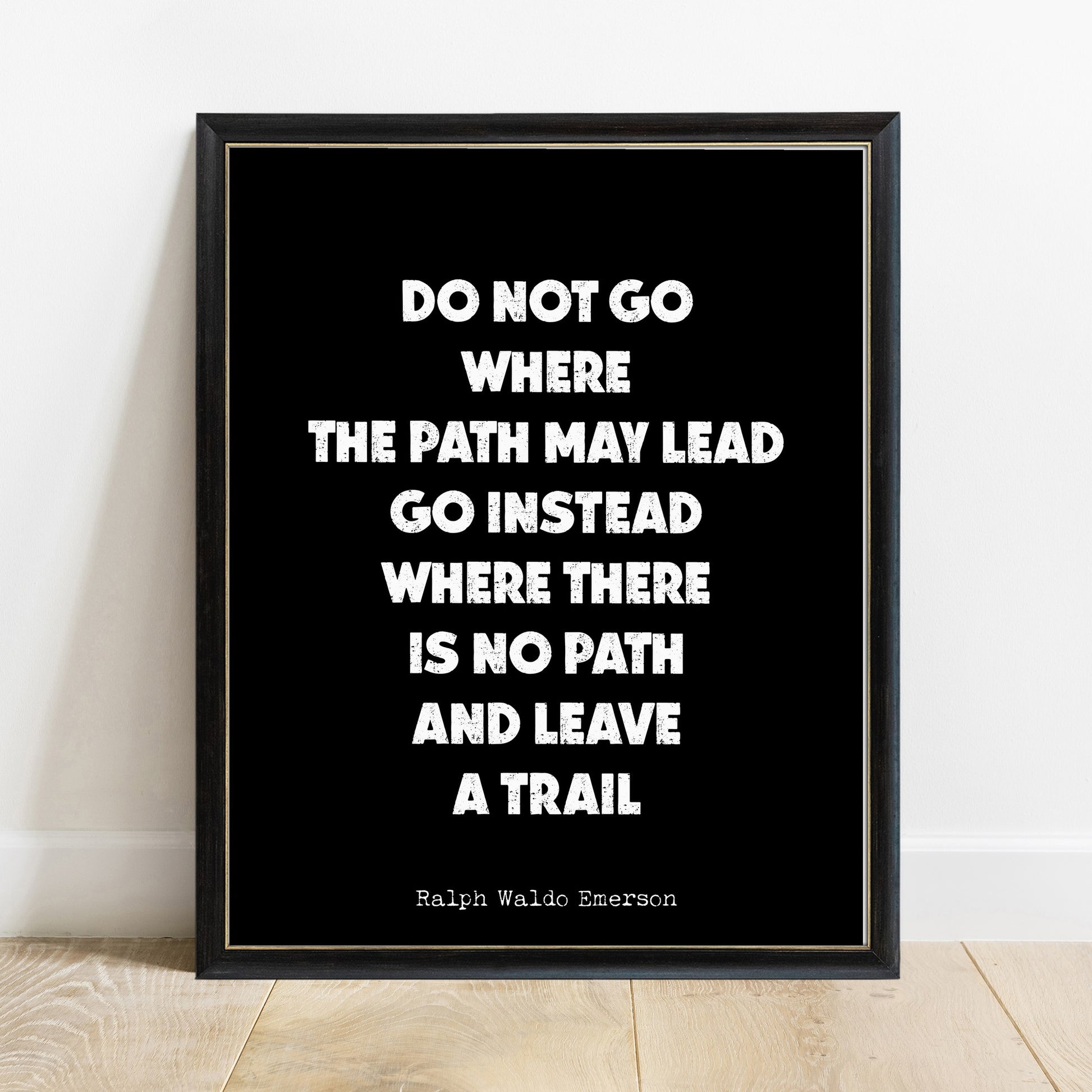 Emerson do not go where the path may lead quote print in a black frame, black background