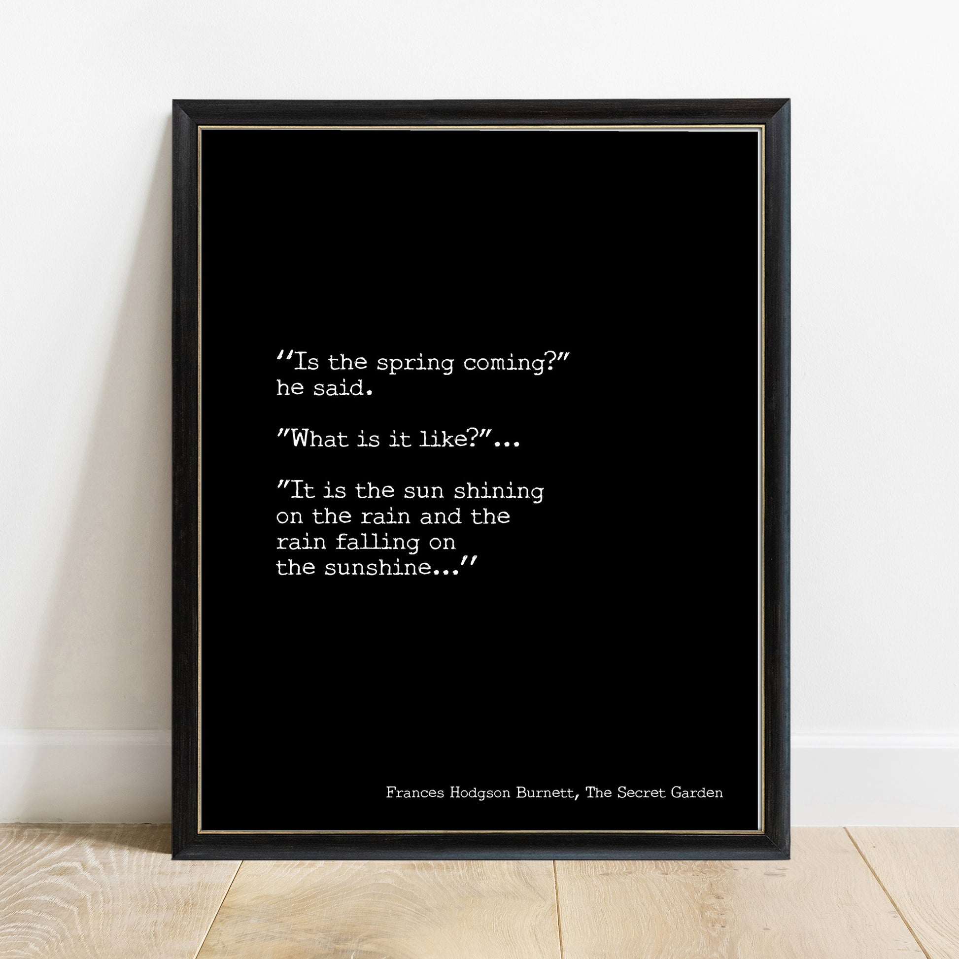 The Secret Garden is the spring coming quote print in a black frame, black background