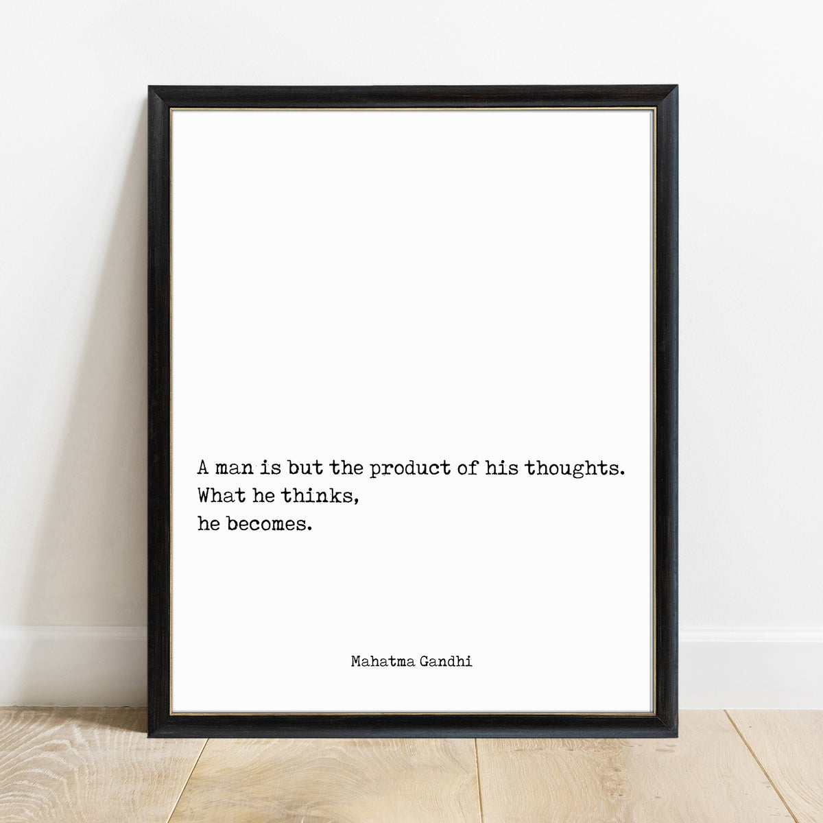 Mahatma Gandhi a man is but the product of his thoughts quote print in a black frame, white background