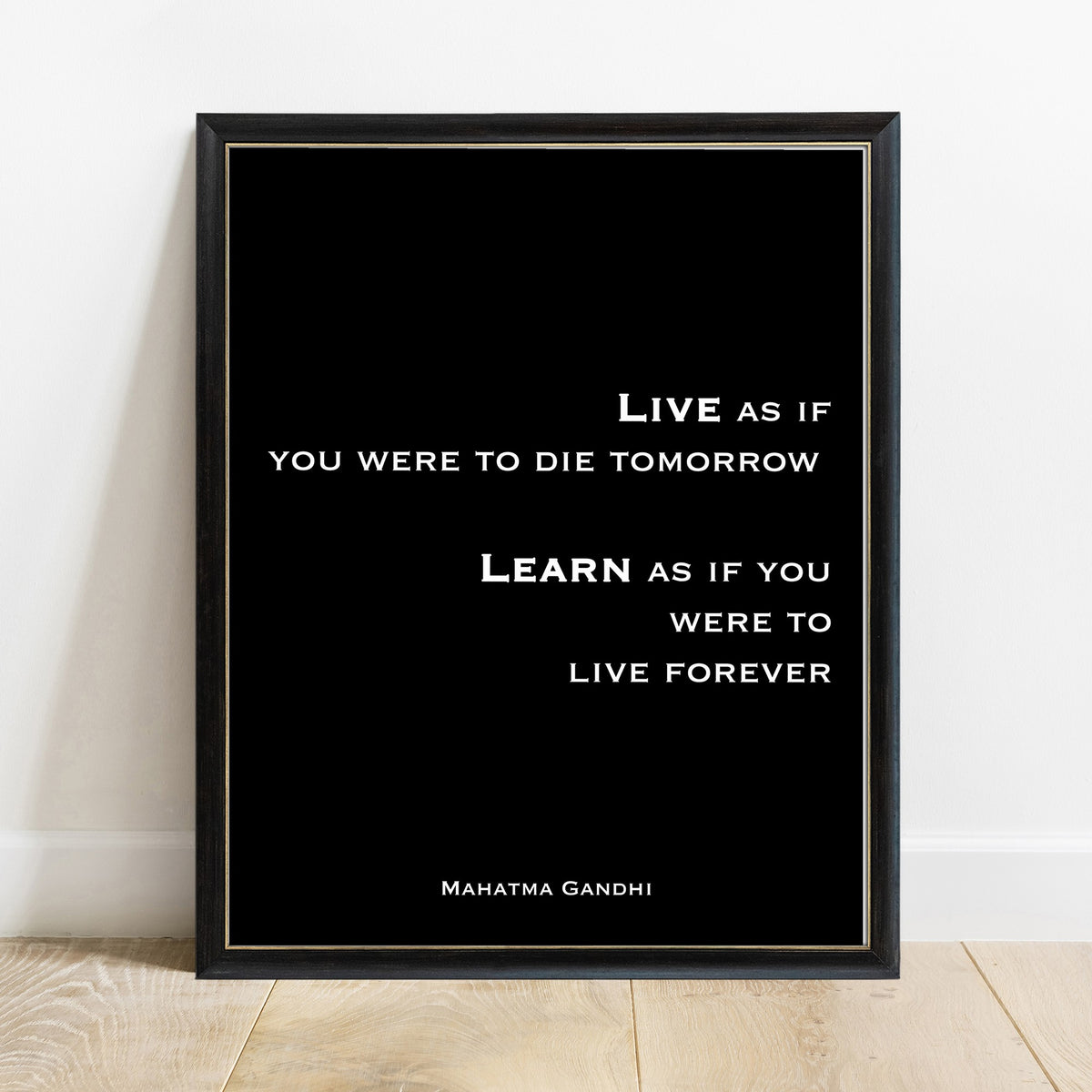 Gandhi live as if you were to die tomorrow print in a black frame, black background