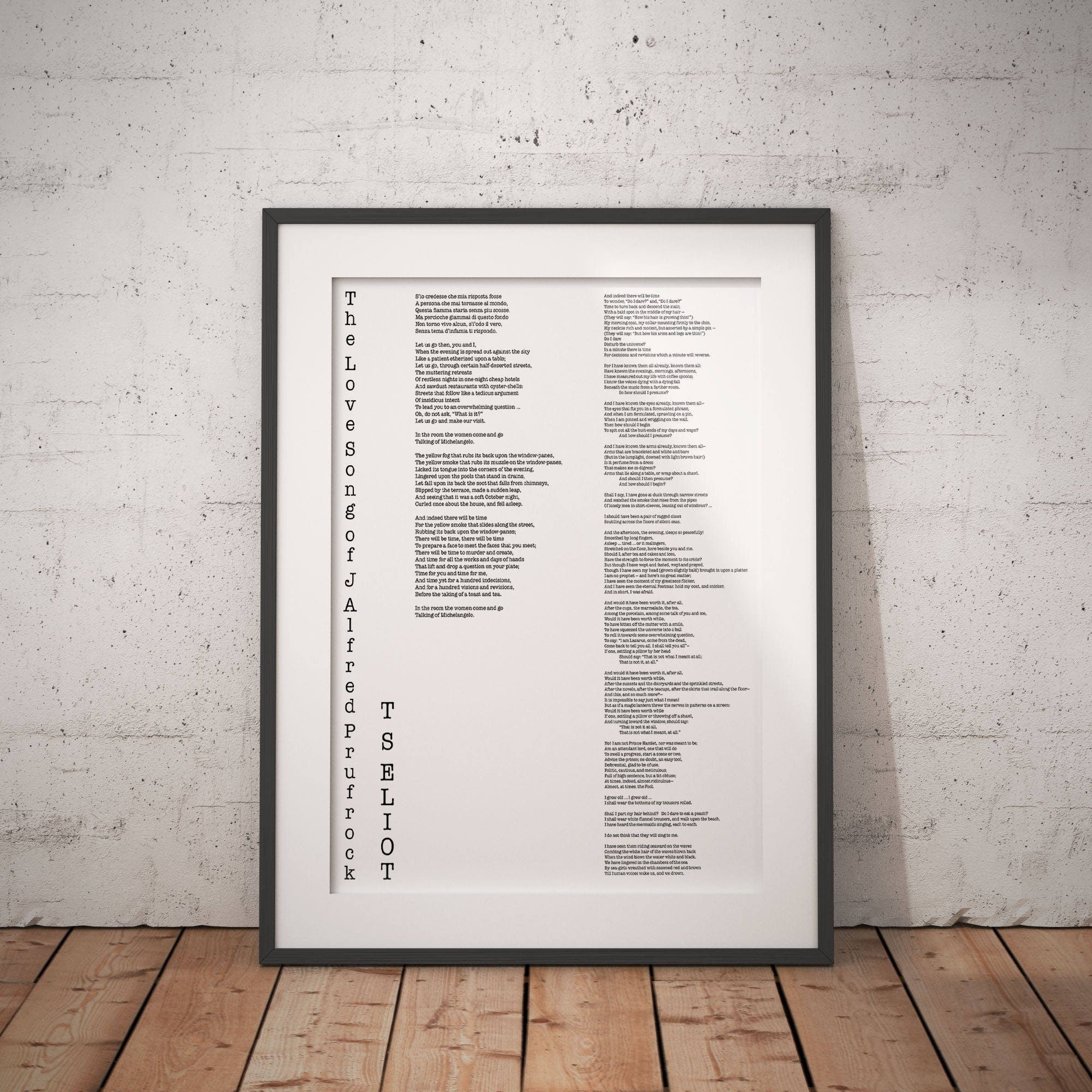May include: A black framed print of a poem titled 'The Love Songs of J. Alfred Prufrock' by T.S. Eliot. The poem is printed in a typewriter font and is centered on the page. The poem is a classic of modern literature and is known for its themes of alienation, anxiety, and the search for meaning in a modern world.
