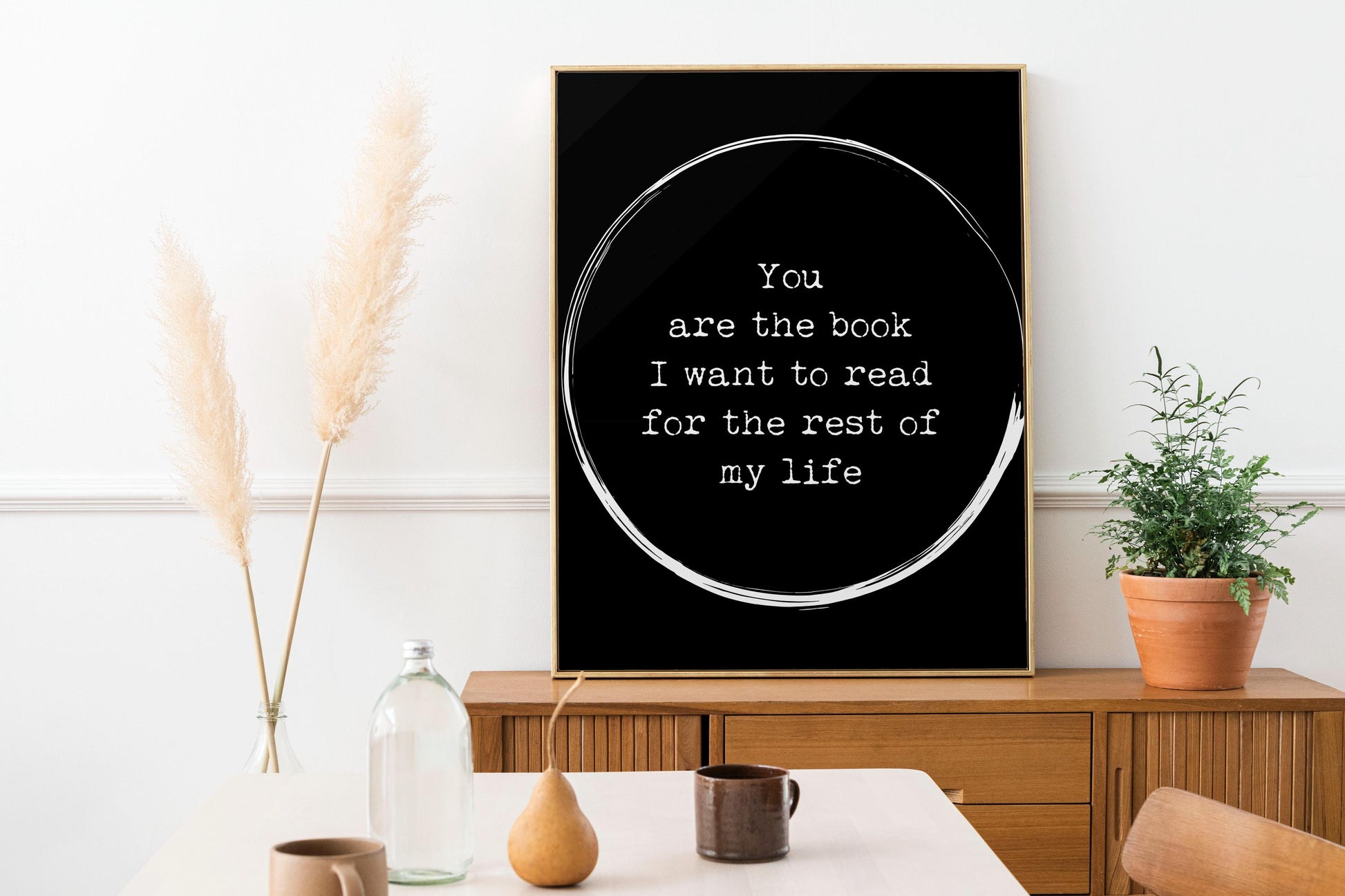 May include: A black and white poster with a white circle and the text 'You are the book I want to read for the rest of my life'.