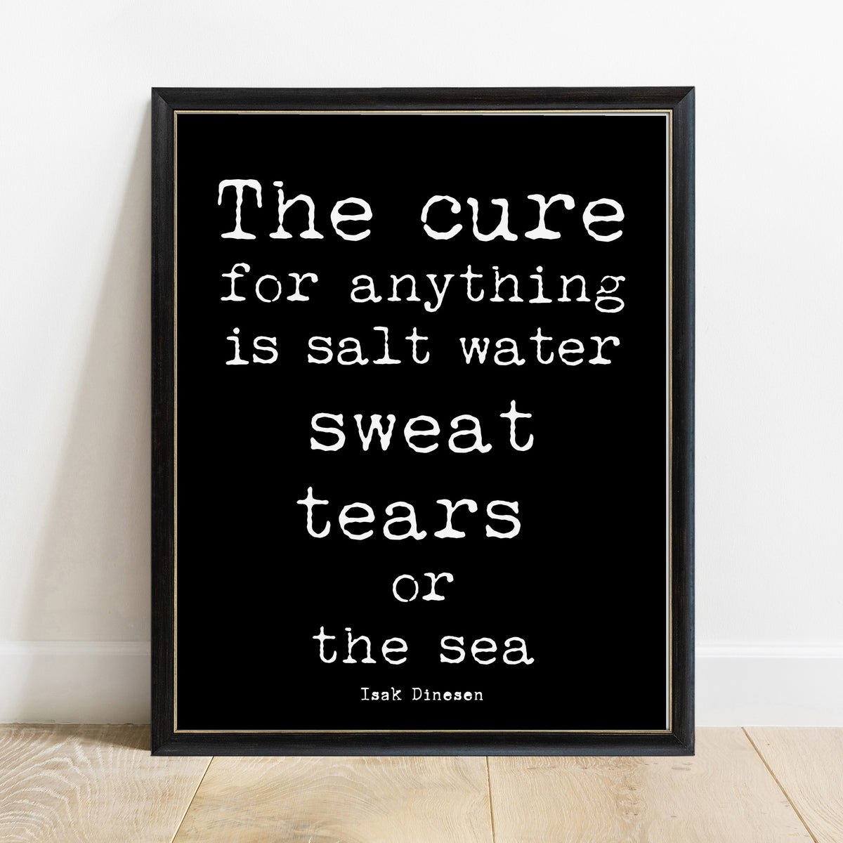 Isak Dinesen salt water cure quote print in a black frame, black background