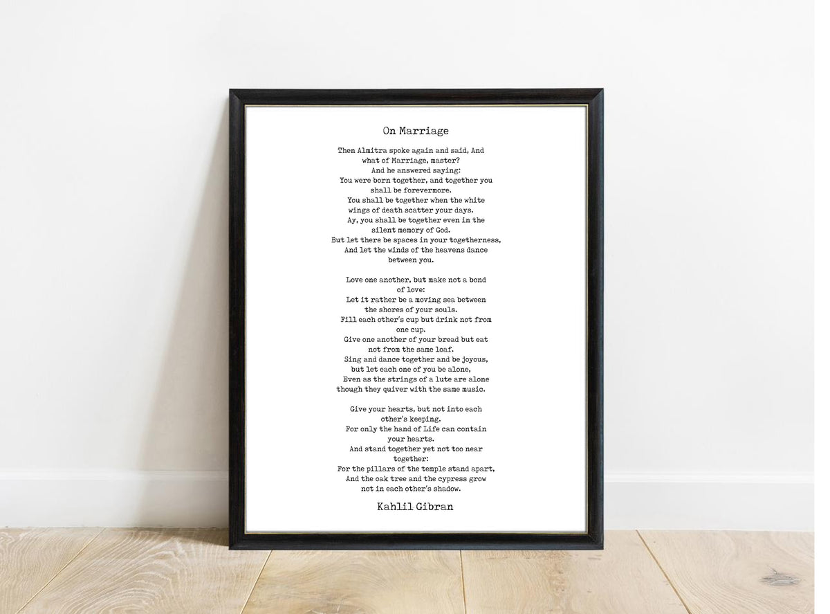 Kahlil Gibran On Marriage poem print in a black frame, white background