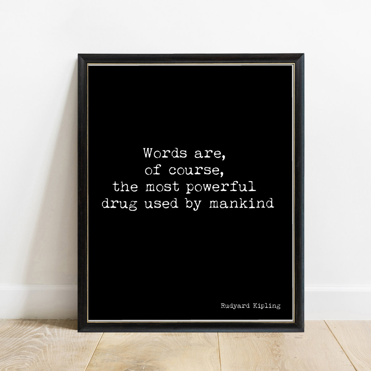 Rudyard Kipling words are the most powerful drug quote print in a black frame, black background