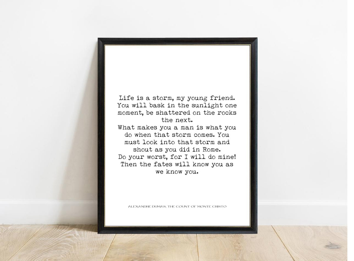 Alexandre Dumas Life Is a Storm quote print in a black frame, white background