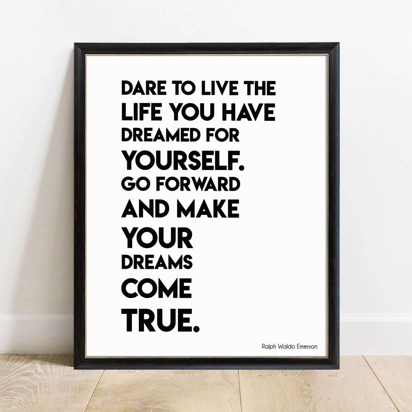 Dare to live the life you have dreamed Emerson bold print in a black frame, white background