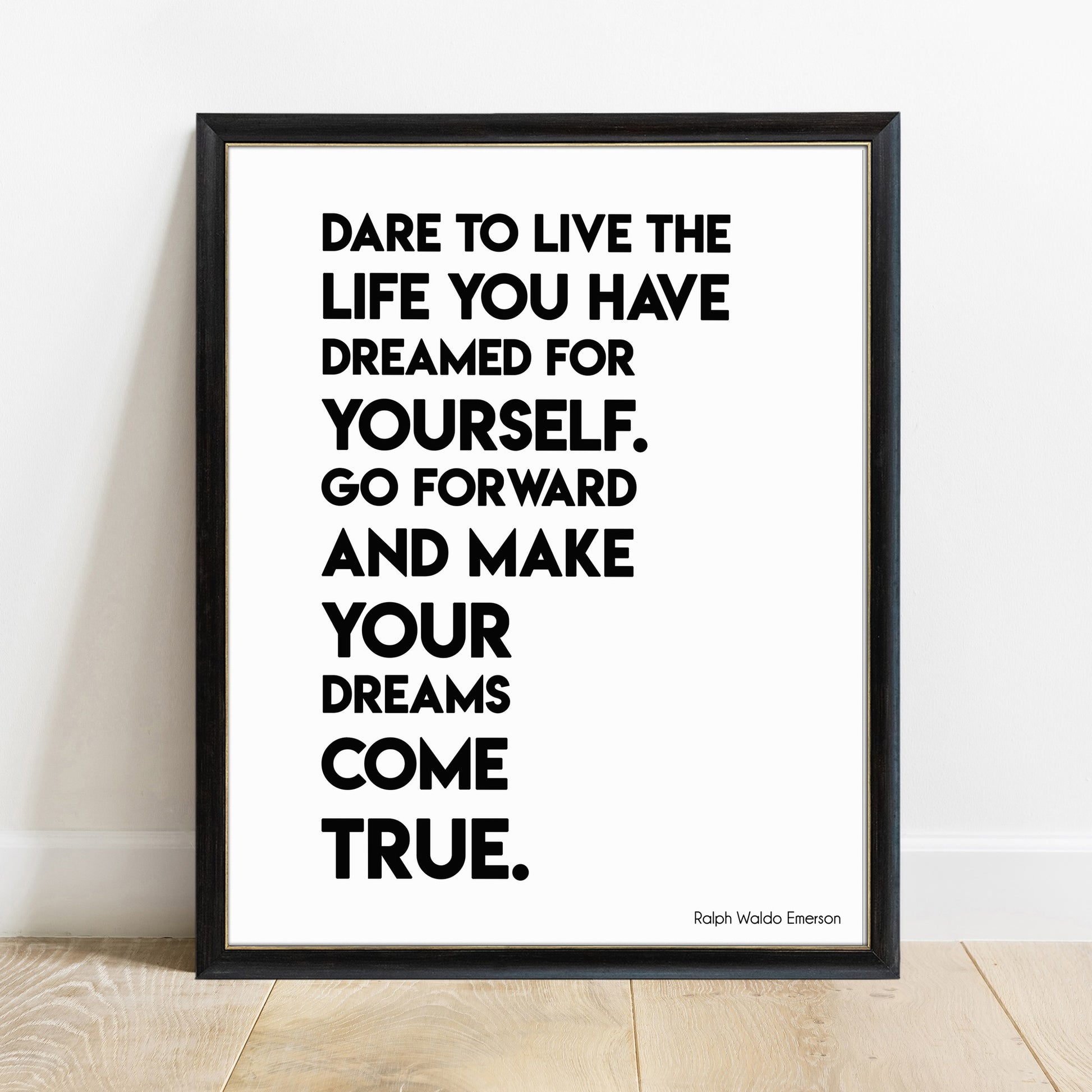 Dare to live the life you have dreamed Emerson bold print in a black frame, white background
