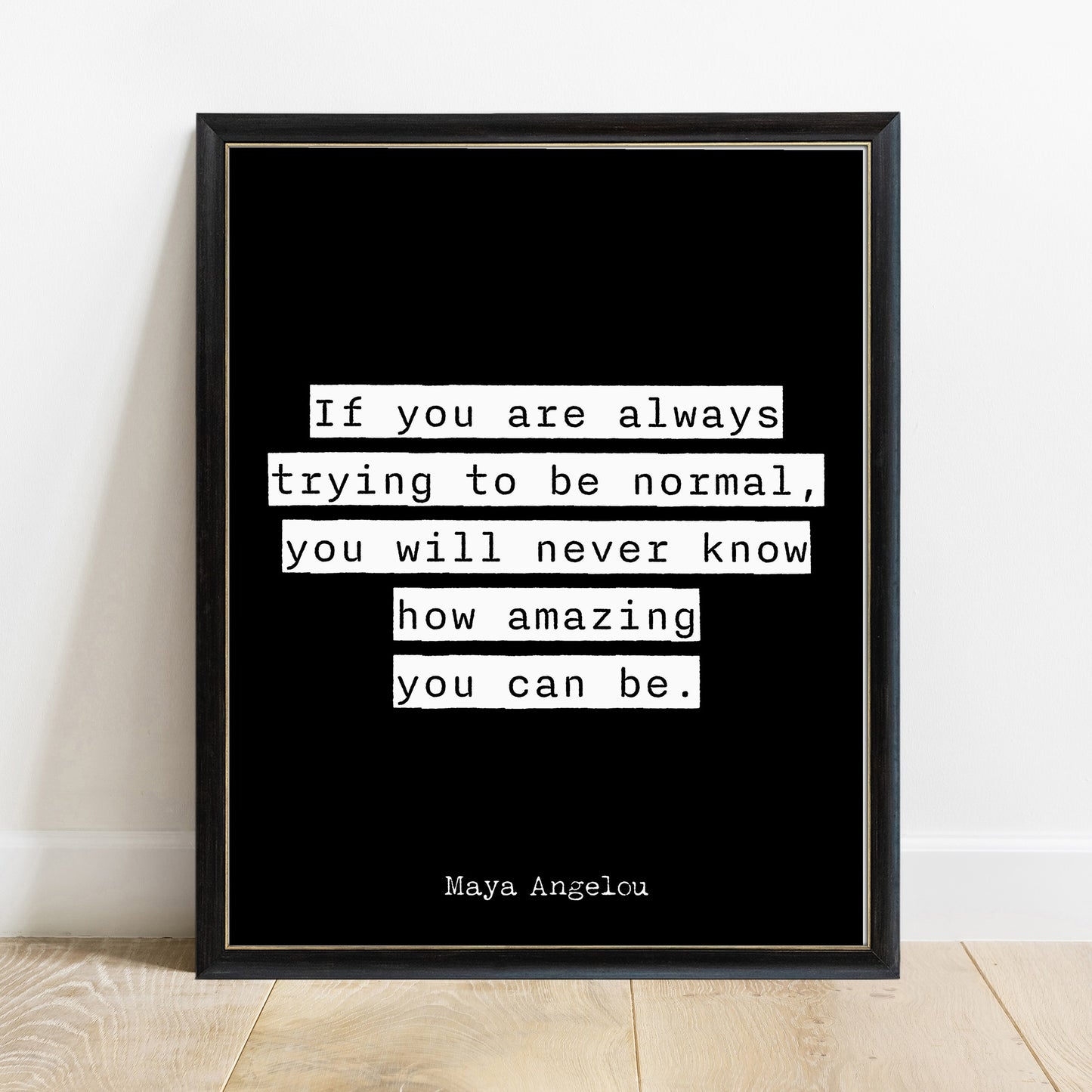 Maya Angelou trying to be normal quote print in a black frame, black background