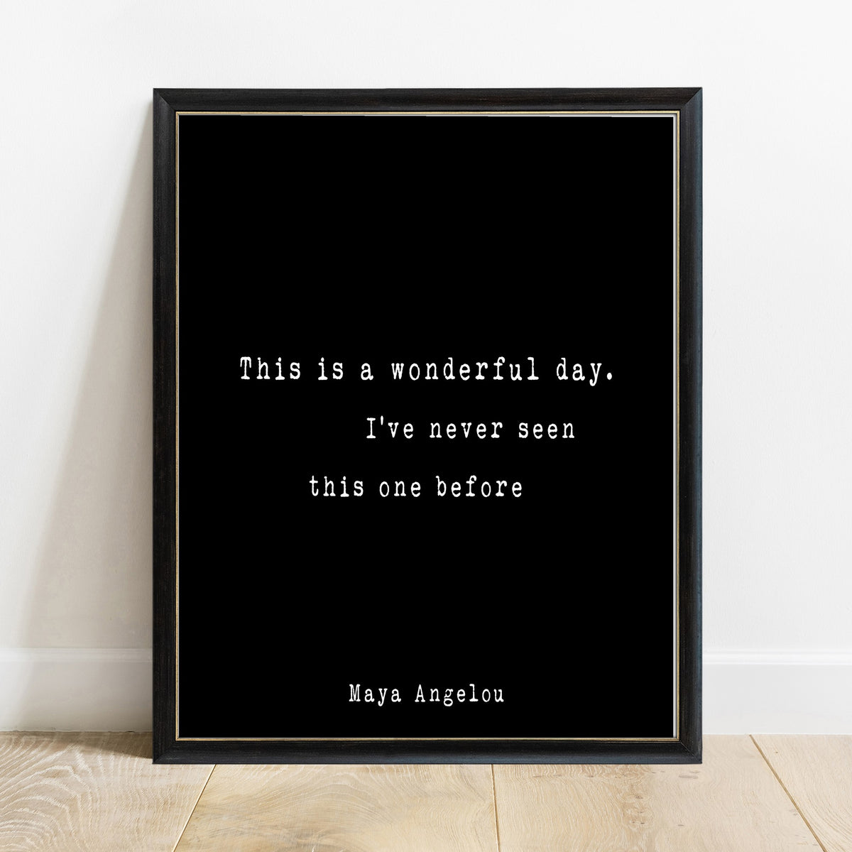 Maya Angelou this is a wonderful day print in a black frame, black background