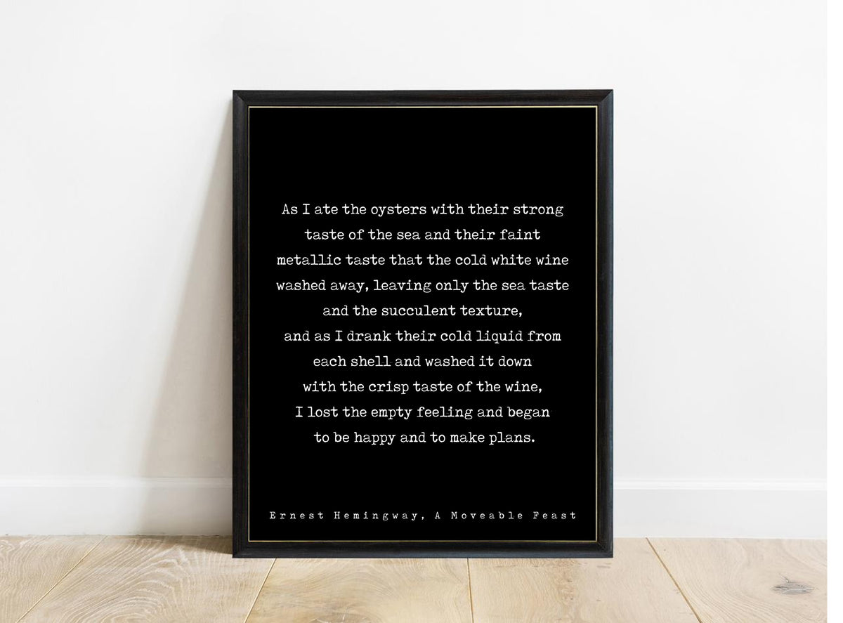Ernest Hemingway A Moveable Feast oysters and cold white wine typewriter quote print in a black frame, black background