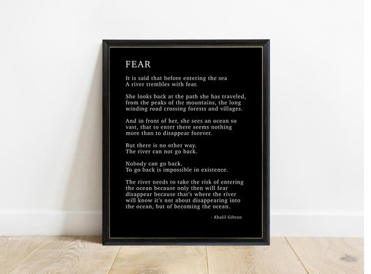 Kahlil Gibran Fear poem print in a black frame, black background