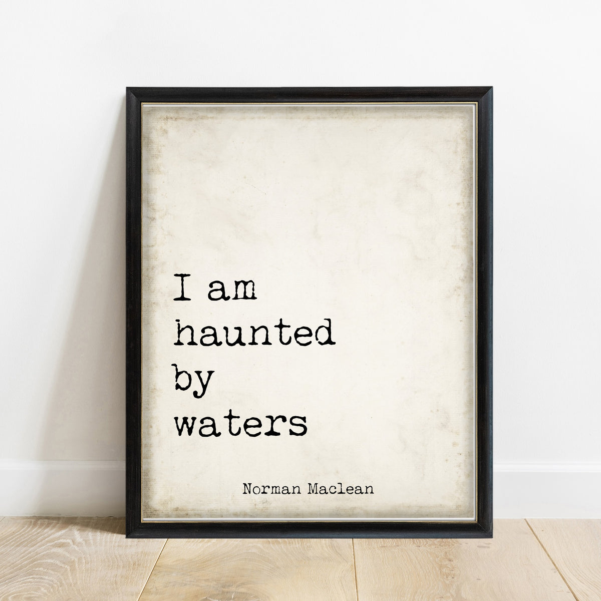Norman Maclean I Am Haunted By Waters print in a black frame, vintage background