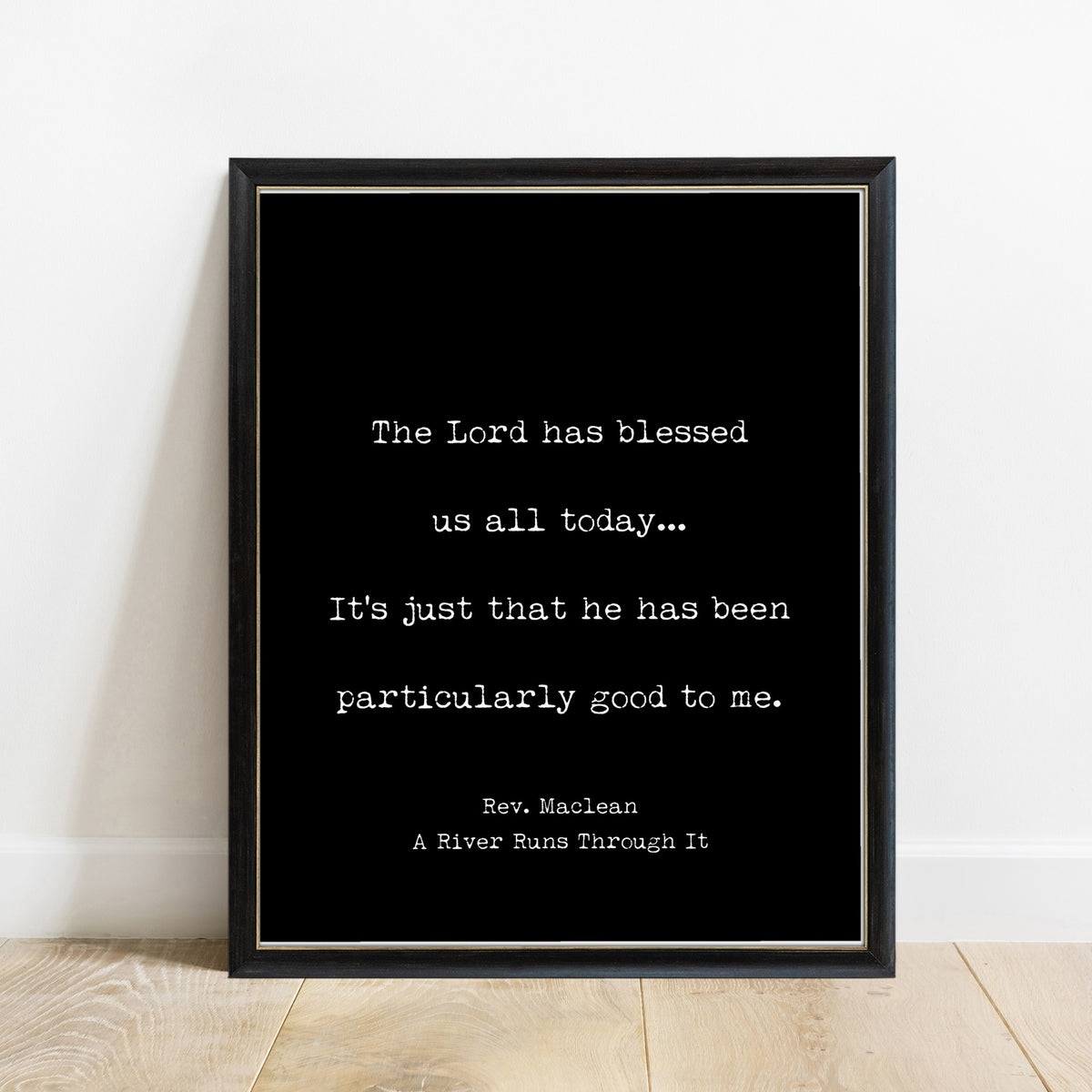 A River Runs Through It The Lord Has Blessed Us All Today print in a black frame, black background
