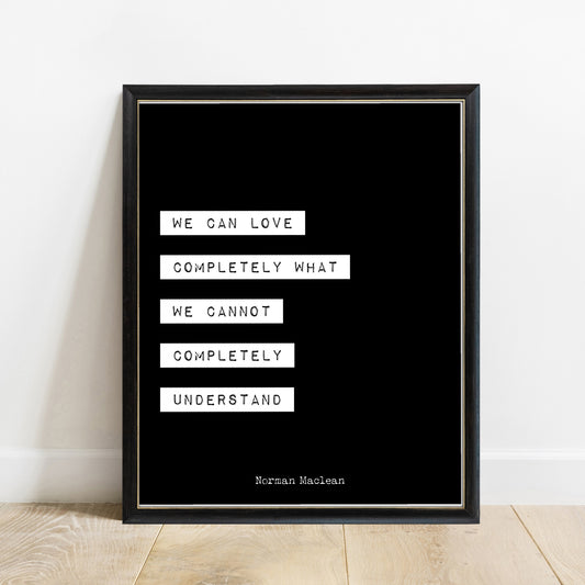 Norman Maclean We Can Love Completely print in a black frame, black background
