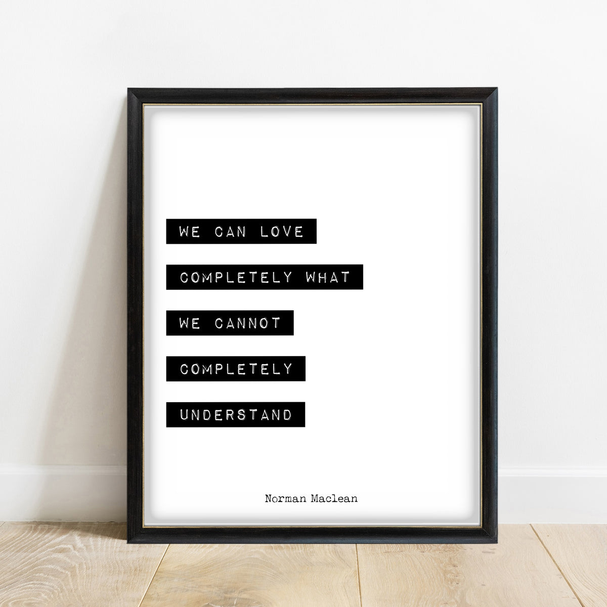 Norman Maclean We Can Love Completely print in a black frame, white background