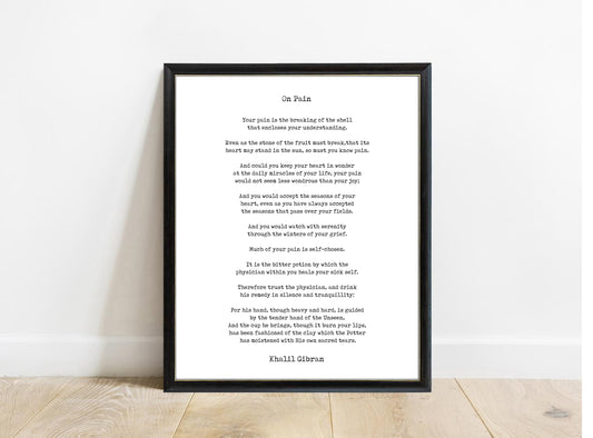 Kahlil Gibran On Pain poem print in a black frame, white background