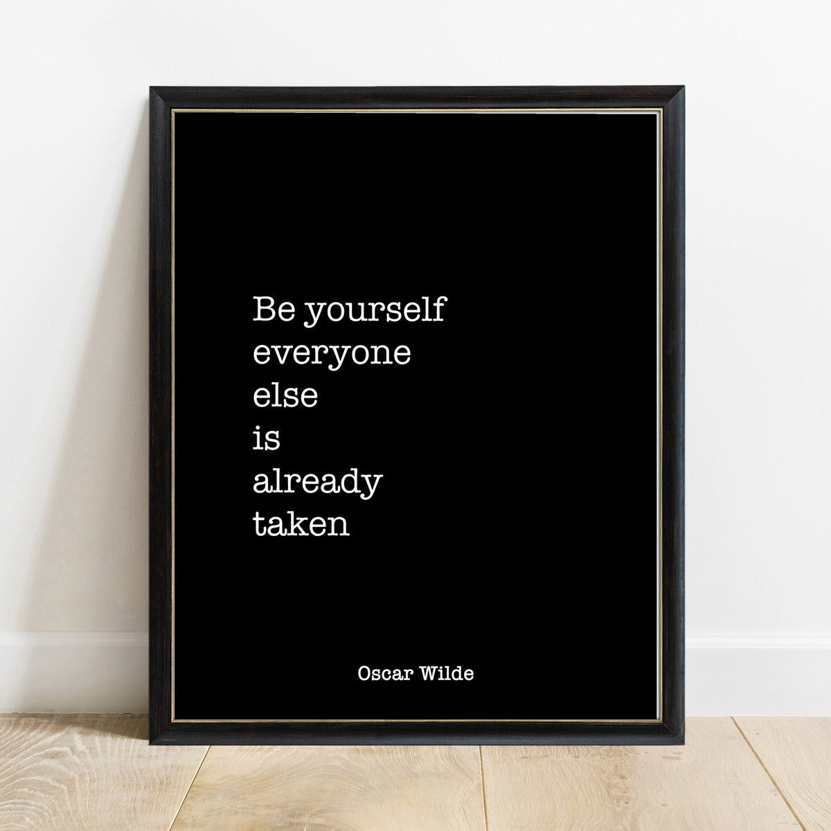 Oscar Wilde be yourself everyone else is already taken quote print in a black frame, black background