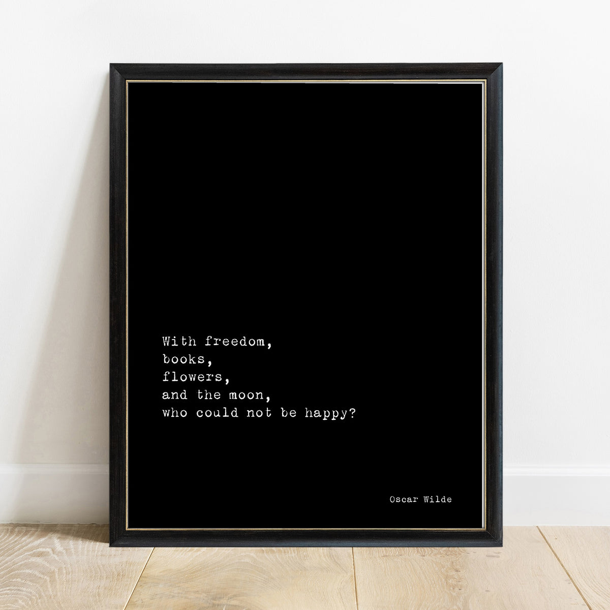 Oscar Wilde with freedom, books, flowers and the moon quote print in a black frame, black background