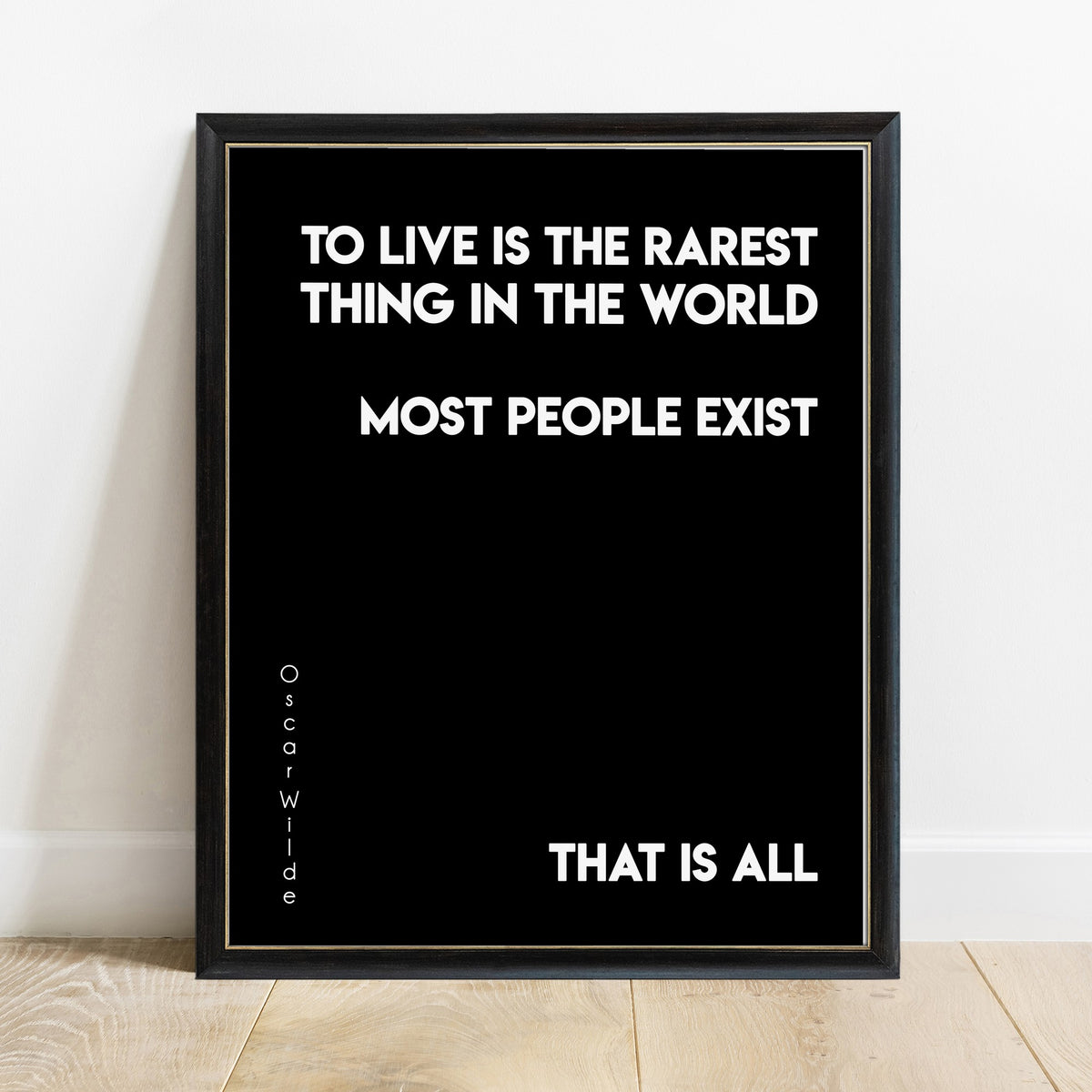 Oscar Wilde to live is the rarest thing quote print in a black frame, black background