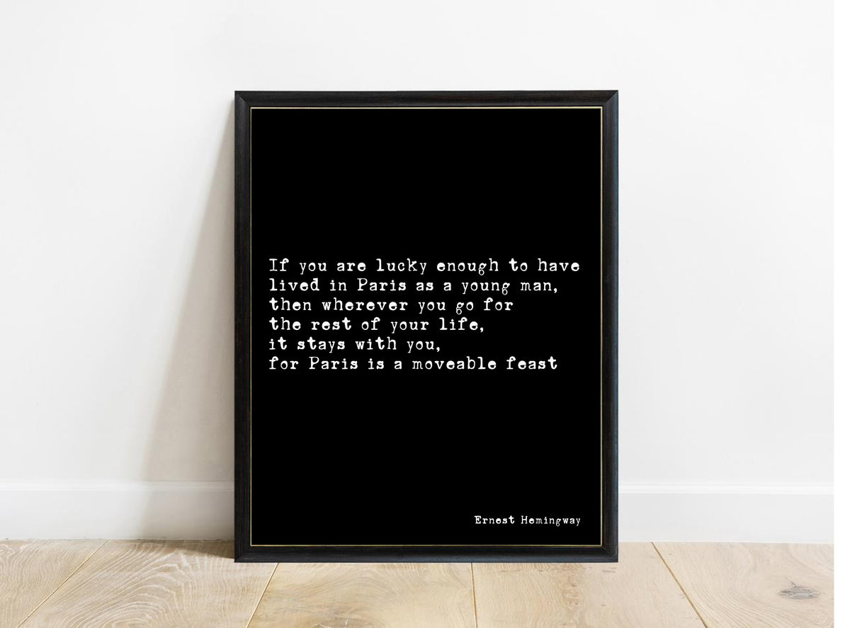 Ernest Hemingway Paris is a moveable feast quote print in a black frame, black background