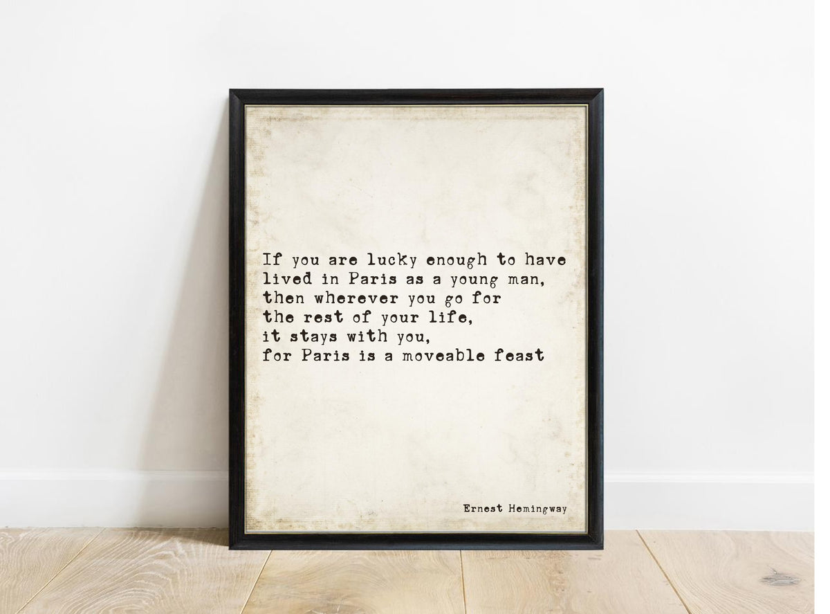 Ernest Hemingway Paris is a moveable feast quote print in a black frame, vintage background