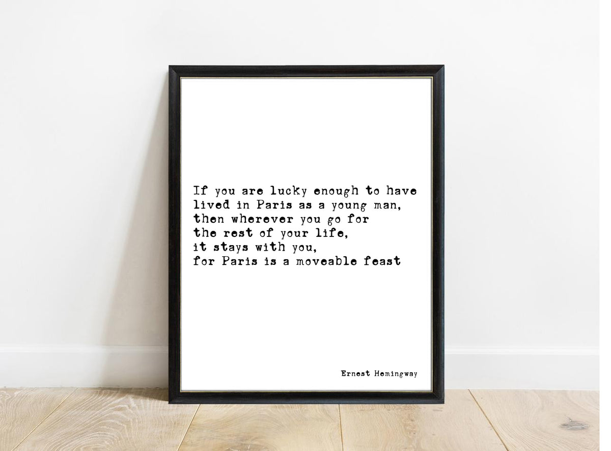 Ernest Hemingway Paris is a moveable feast quote print in a black frame, white background