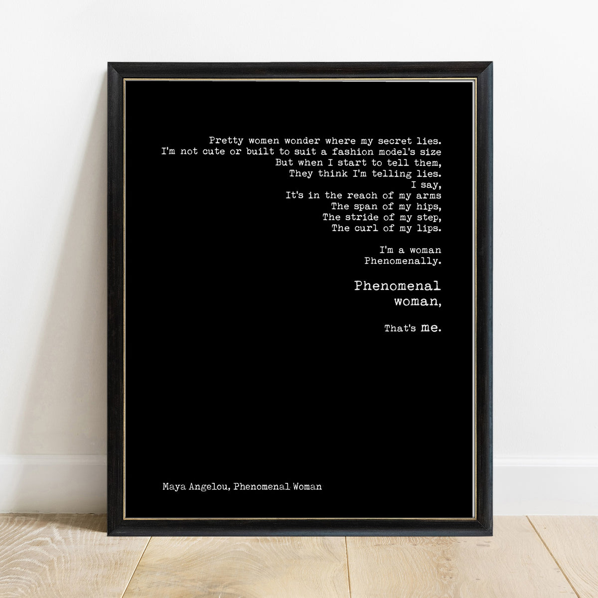 Maya Angelou Phenomenal Woman excerpt print in a black frame, black background