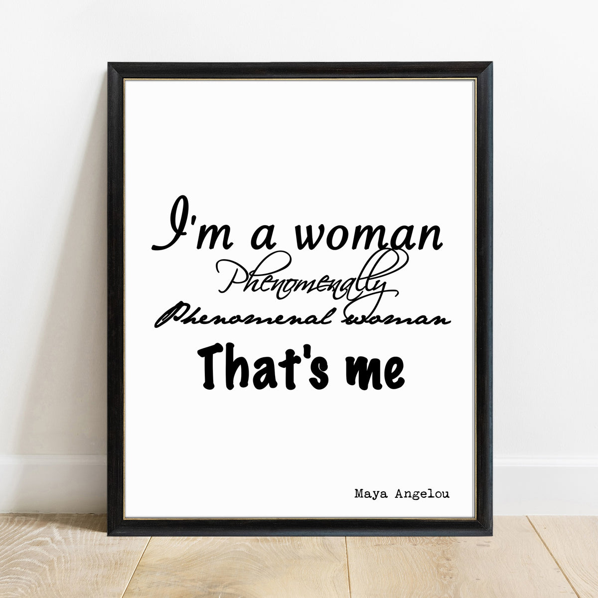 Maya Angelou I'm a woman phenomenally script print in a black frame, white background