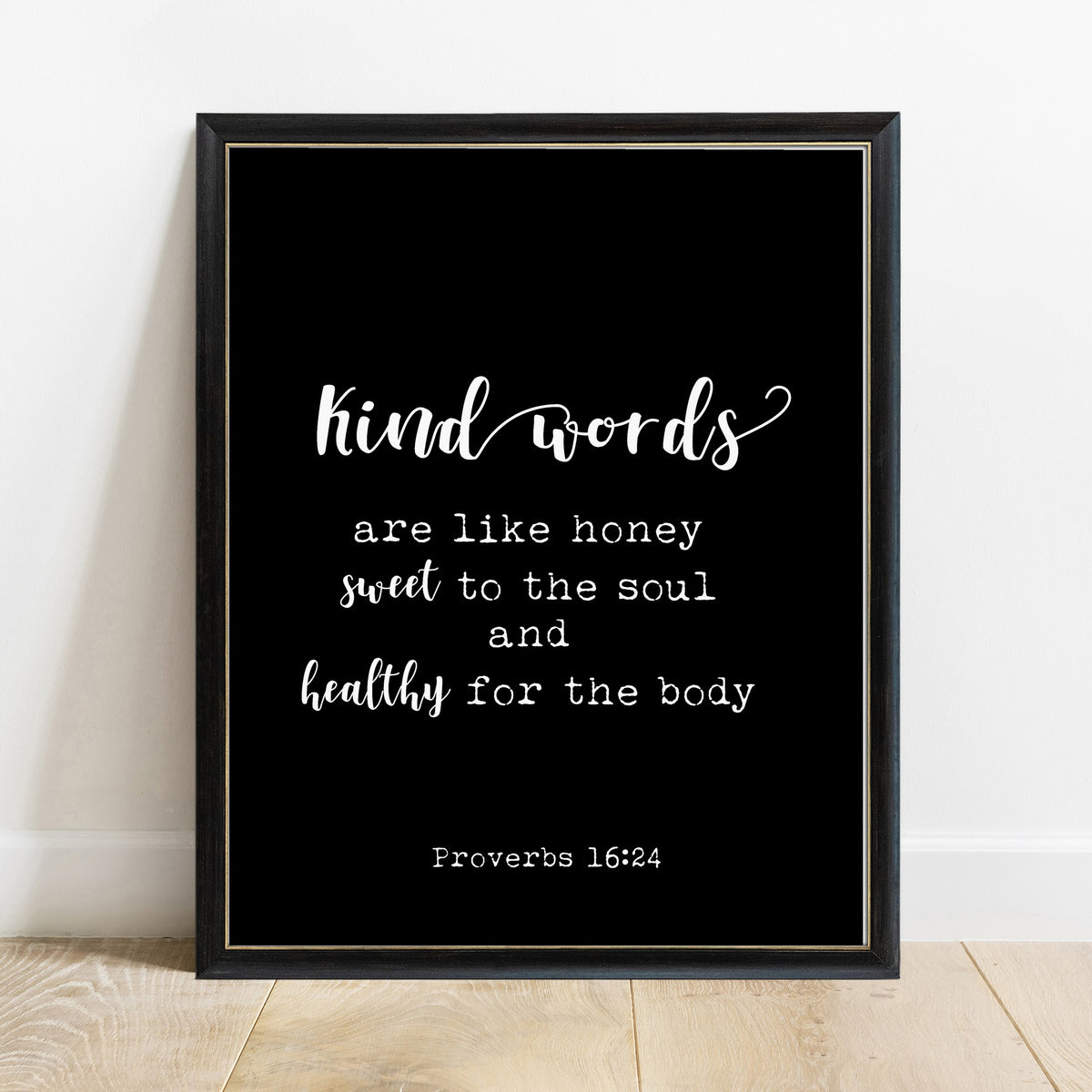 Proverbs 16:24 kind words are like honey scripture print in a black frame, black background