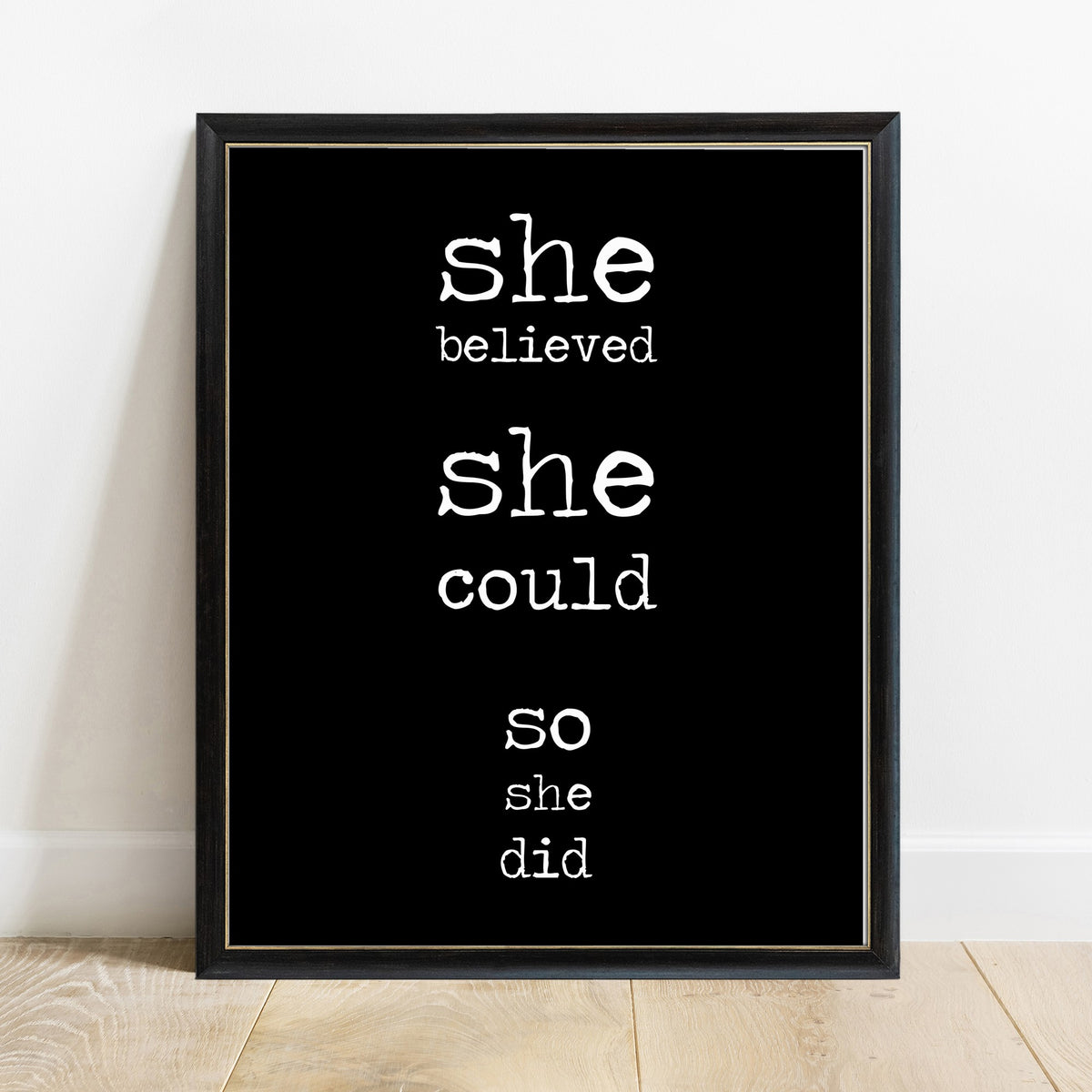 She Believed She Could So She Did quote print, in a black frame, black background