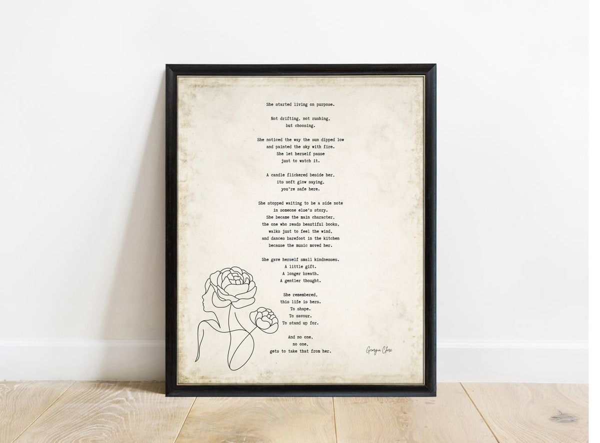 Georgia Clare She Started Living on Purpose poem print in a black frame, vintage background
