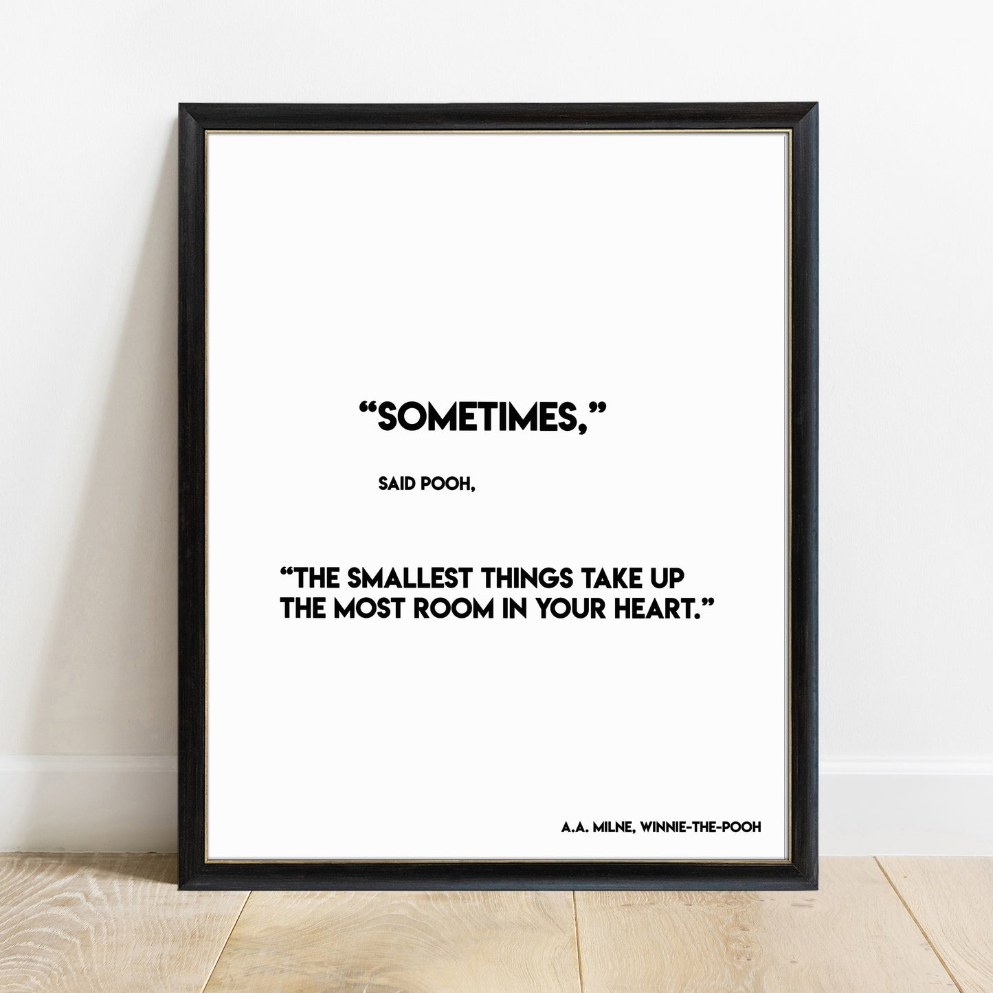 Winnie the Pooh smallest things quote print in a black frame, white background