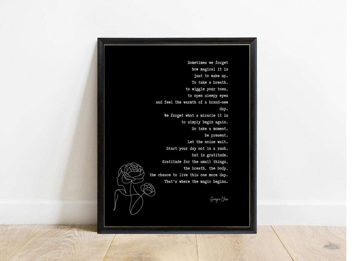 Georgia Clare Sometimes We Forget gratitude poem print in a black frame, black background