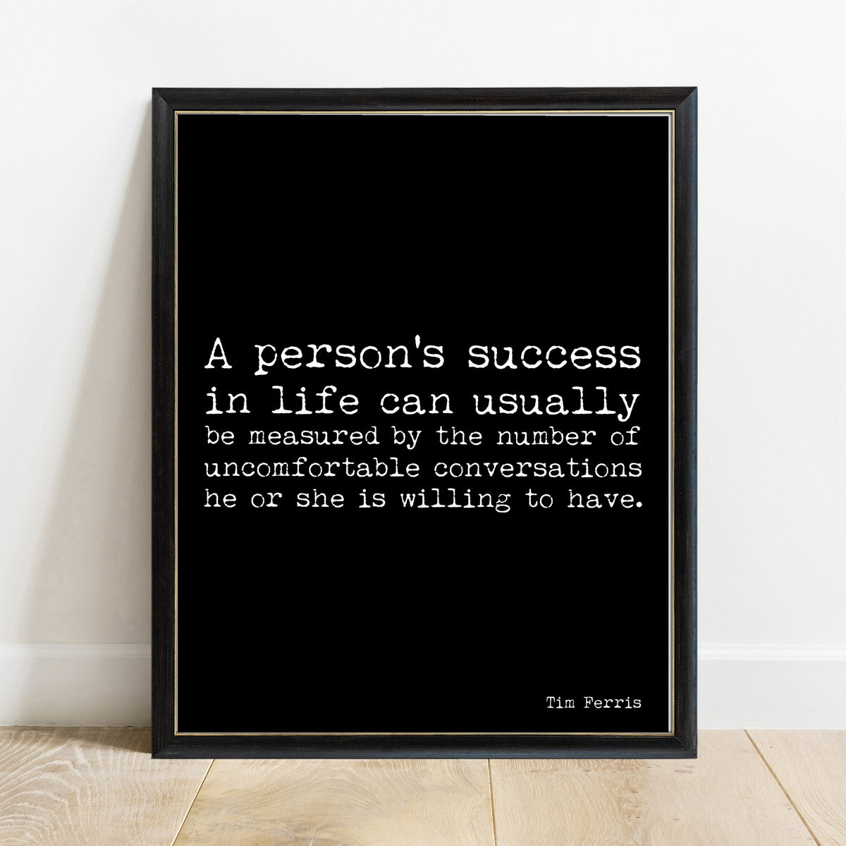 Tim Ferriss uncomfortable conversations success quote print in a black frame, black background
