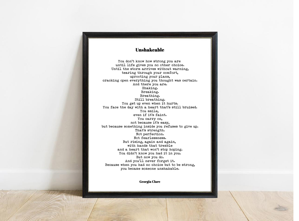 Georgia Clare Unshakeable poem print in a black frame, white background