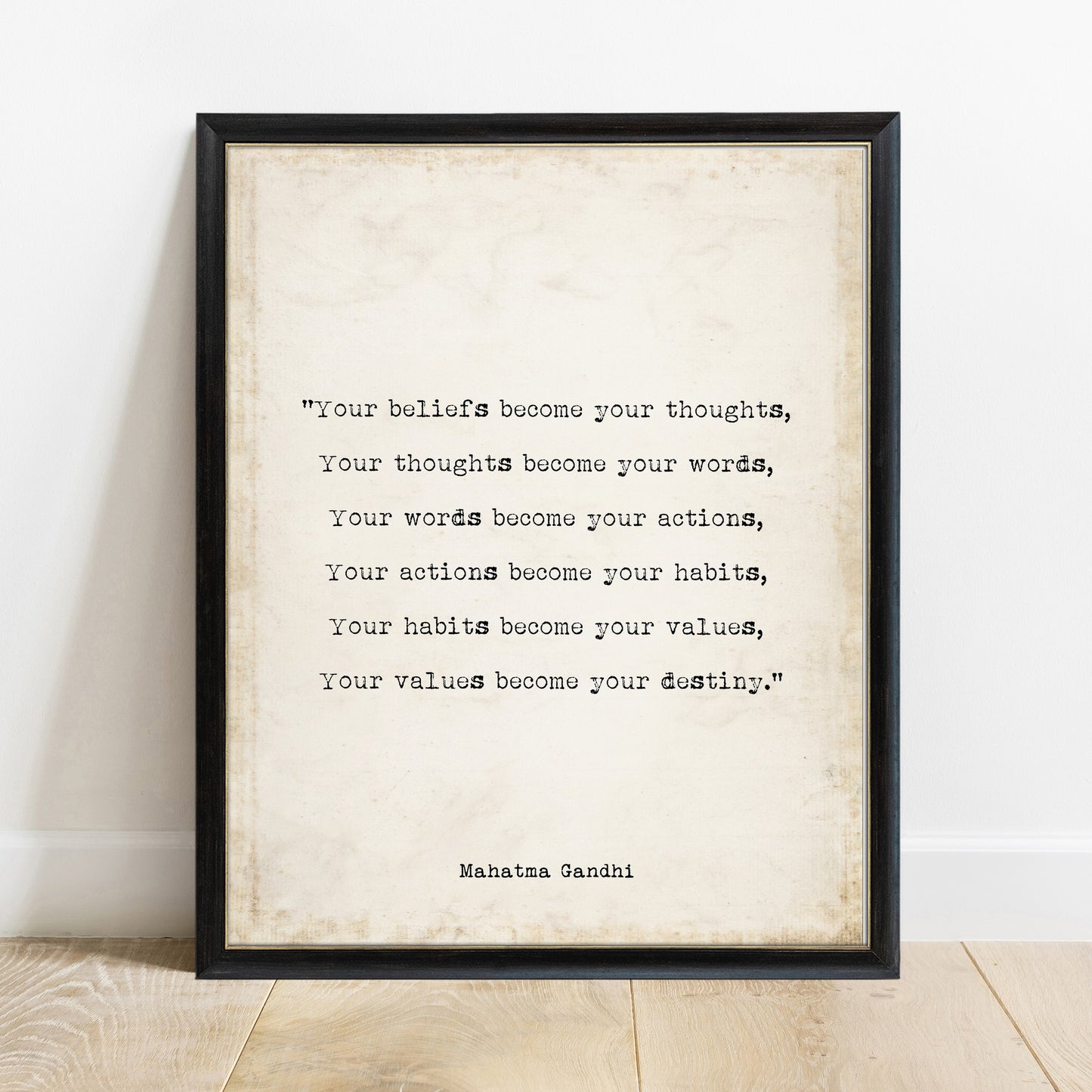 Gandhi your beliefs become your thoughts quote print in a black frame, vintage background