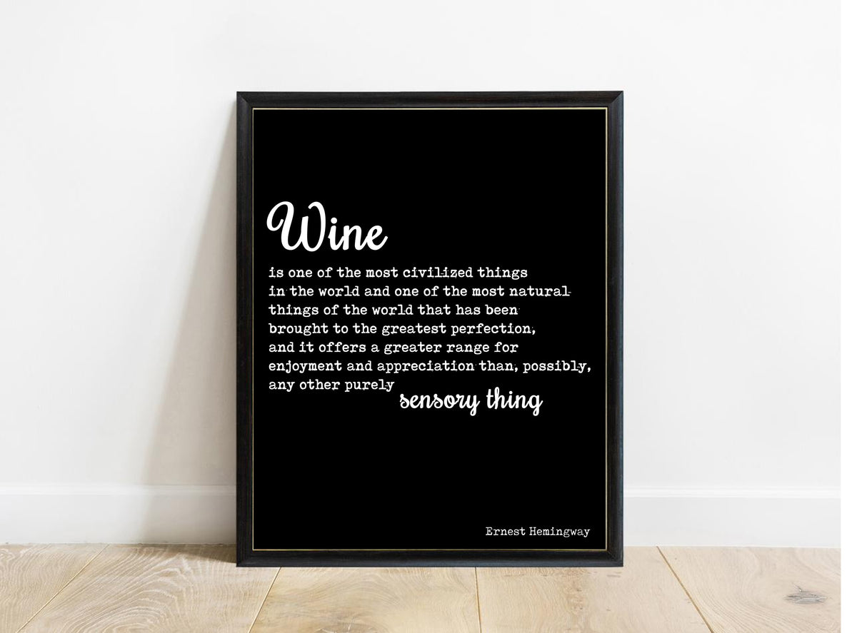 Ernest Hemingway wine is one of the most civilized things quote print in a black frame, black background