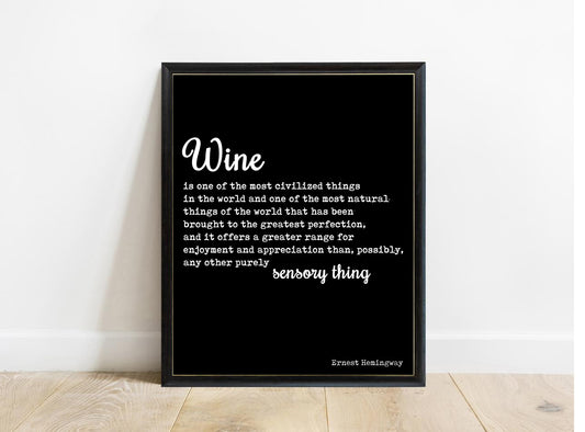 Ernest Hemingway wine is one of the most civilized things quote print in a black frame, black background