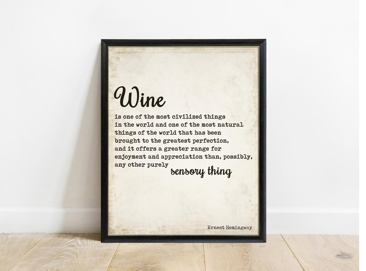 Ernest Hemingway wine is one of the most civilized things quote print in a black frame, vintage background
