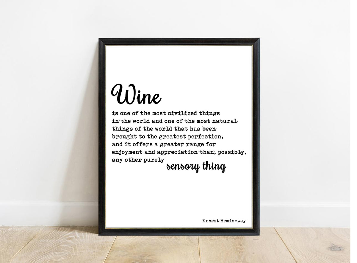 Ernest Hemingway wine is one of the most civilized things quote print in a black frame, white background