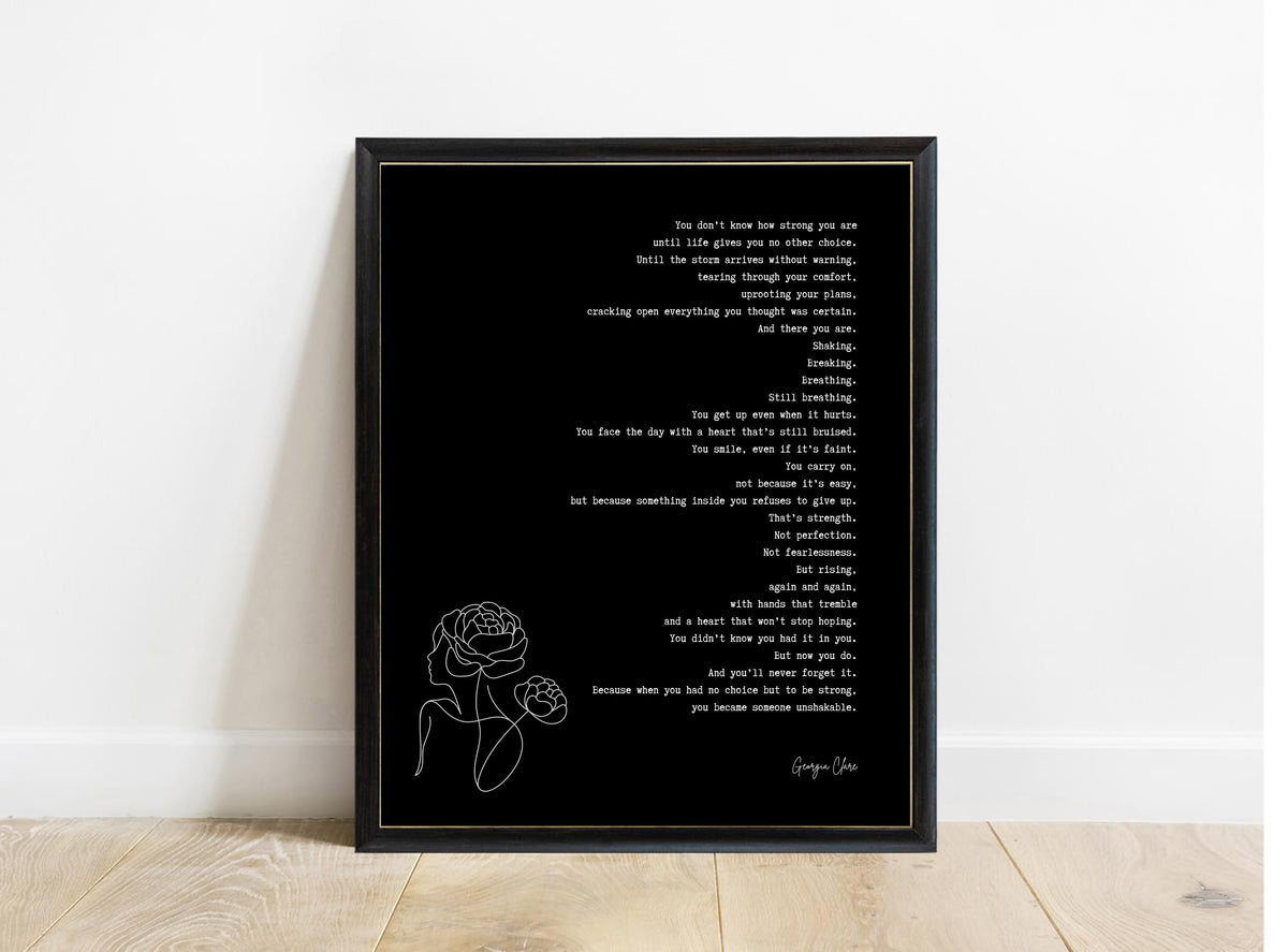 Georgia Clare You Don't Know How Strong You Are poem print in a black frame, black background